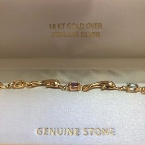 18 kt gold Dolphin bracelet with genuine stones